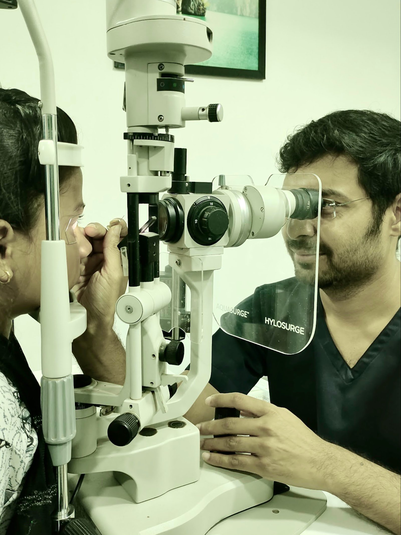 Dr. Abhijit performing a slit-lamp eye examination at Abhijit Eye Clinic